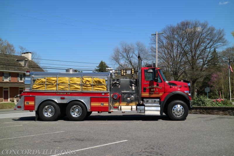 Tanker 59 is a 2008 International and a 1988 4 Guys elliptical tank and body, and has seating for two firefighters. The Tanker carries 2,500 gallons of water pumped by a 1,000 GPM pump. Tanker 59 also carries a 3,000 gallon portable water tank and is able to off load in tanker shuttle off three sides of the apparatus. For fire hose, the Tanker carries 400 feet of 1.75 inch attack line, 400 feet of 3 inch supply line, and 100 feet of 5 inch supply line. The unit also carries forcible entry equipment
